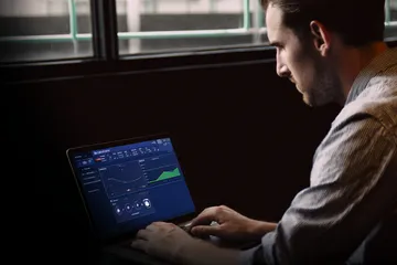 A woman smiling by bright slot machines showing lucky symbols, showcasing the exciting slot offerings at SAGISAGPH.
