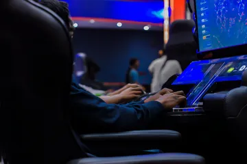 A laptop glowing with a bright login prompt in a minimalistic setup, symbolizing the protected access system at SAGISAGPH.